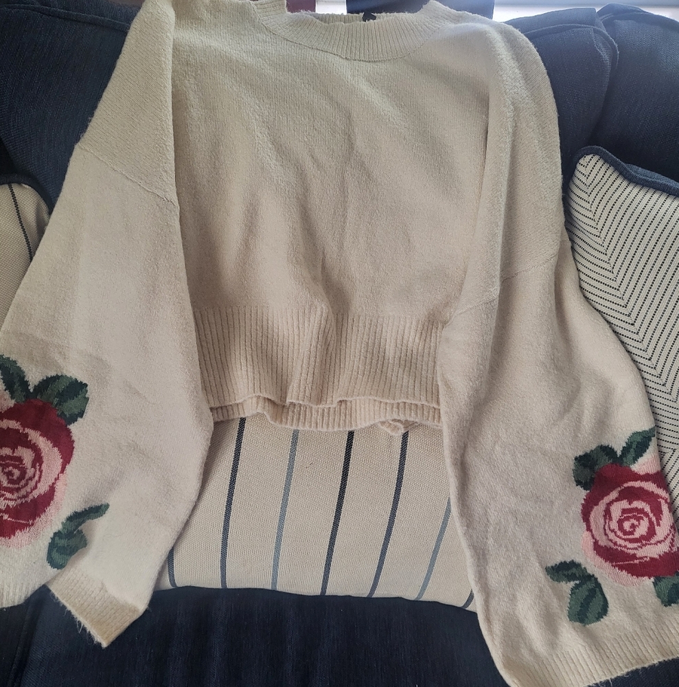 Divided Cream Sweater with Red Floral Accents